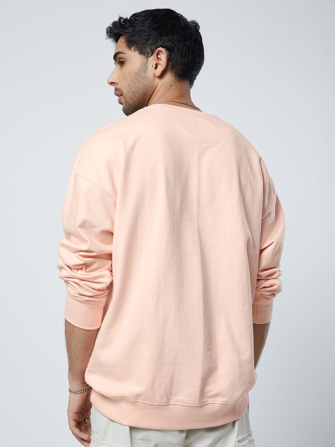 Buy Official Peanuts Chilling Men Oversized Sweatshirts Online.